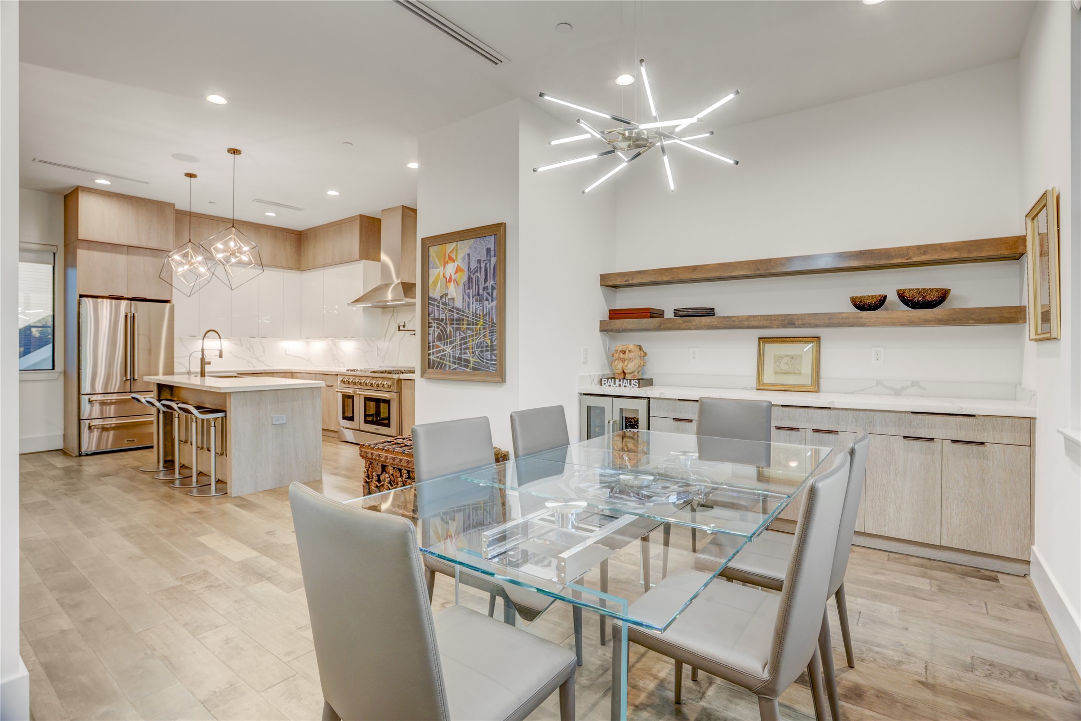 2435 Sheridan Street Houston, TX 77030 - Photo 11 of 25 The dining area with stylish shelving, is seamlessly connected to the kitchen.