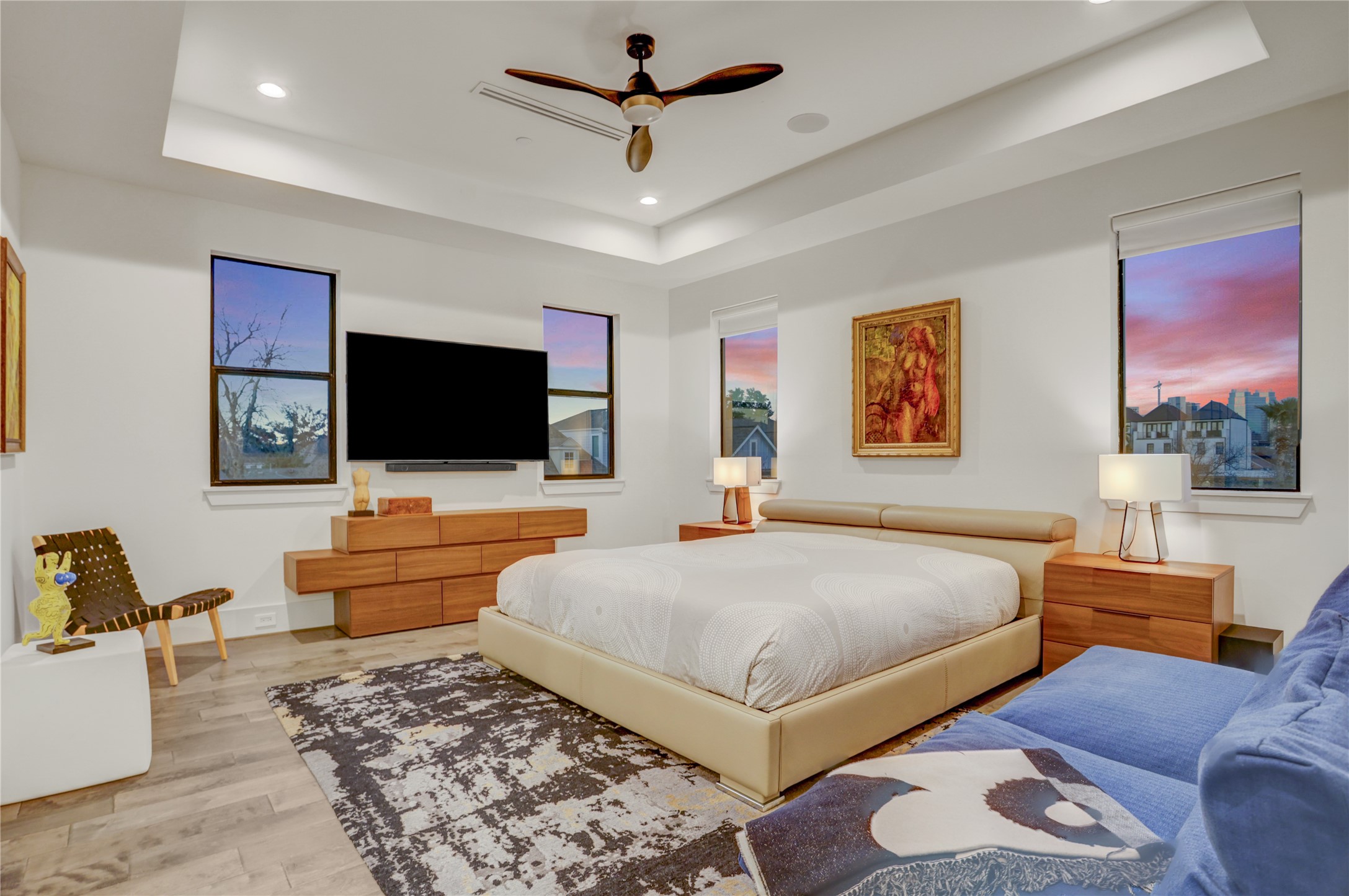 2435 Sheridan Street Houston, TX 77030 - Photo 14 of 25 The luxurious primary bedroom also features an elegant tray ceiling, and modern finishes for a serene environment.