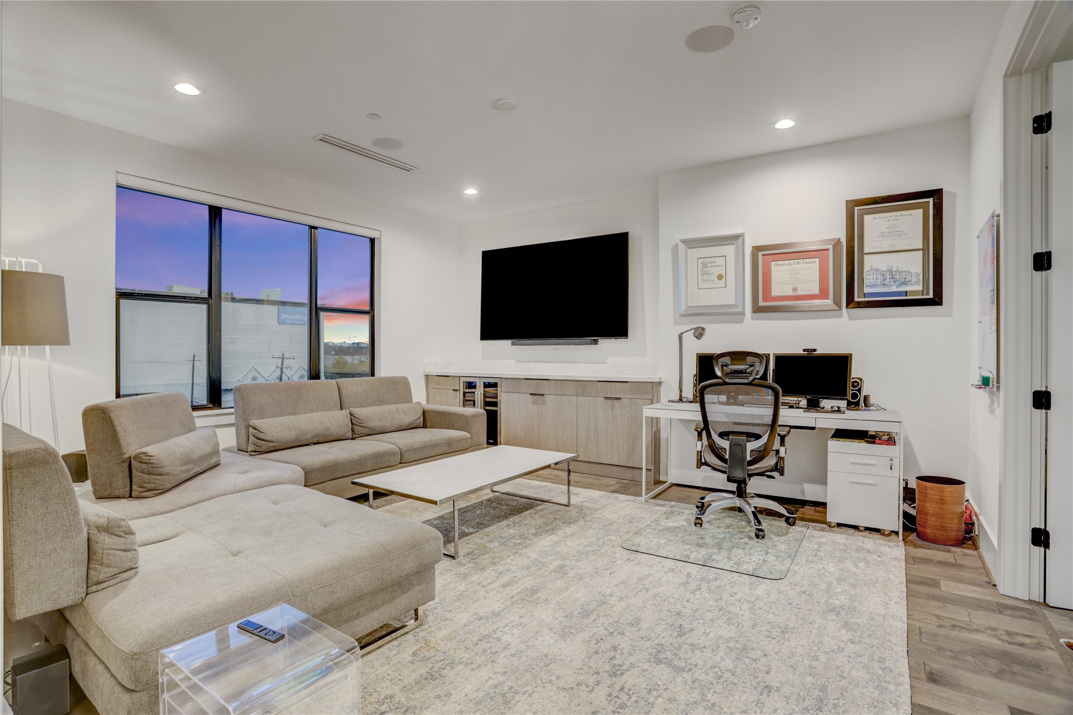 2435 Sheridan Street Houston, TX 77030 - Photo 20 of 25 a living room with furniture and a flat screen tv