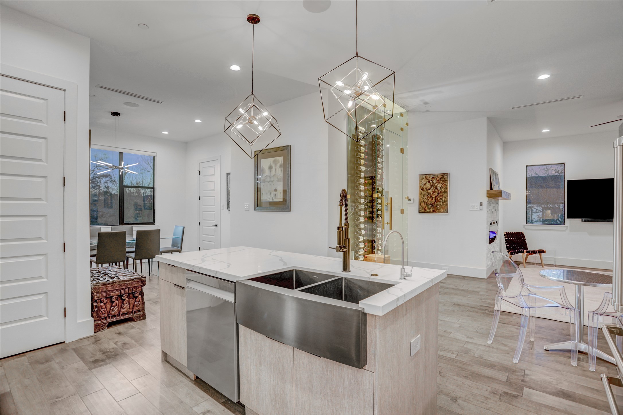 2435 Sheridan Street Houston, TX 77030 - Photo 9 of 25 a kitchen with stainless steel appliances kitchen island a table and chairs in it