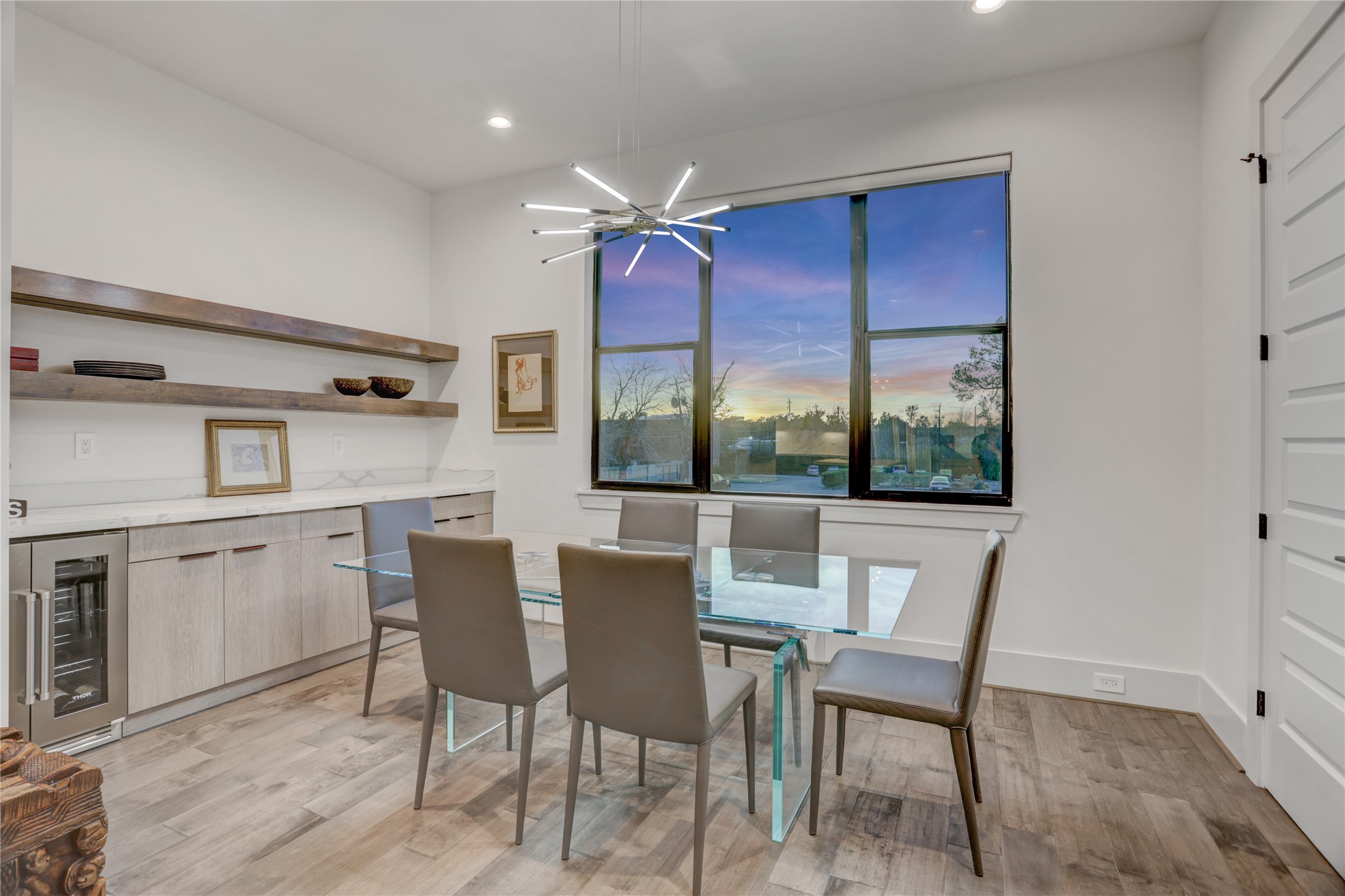 2435 Sheridan Street Houston, TX 77030 - Photo 10 of 25 a dining room with furniture a chandelier and wooden floor