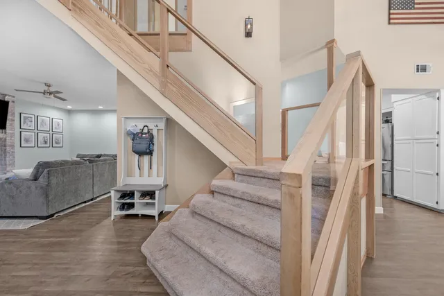 a view of entryway and hall with wooden floor