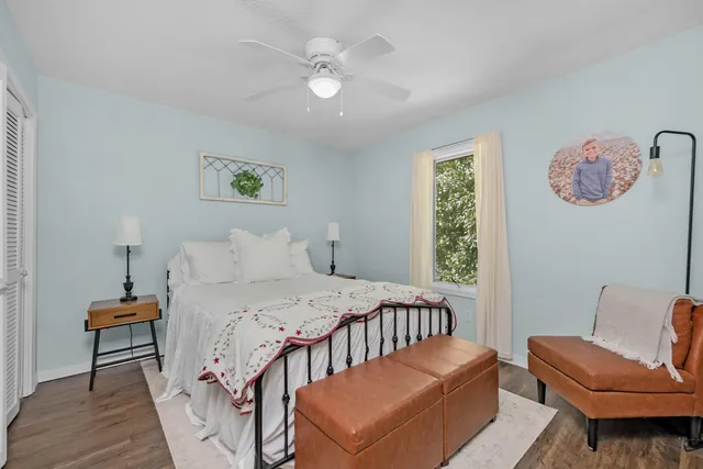 a bedroom with furniture and a window