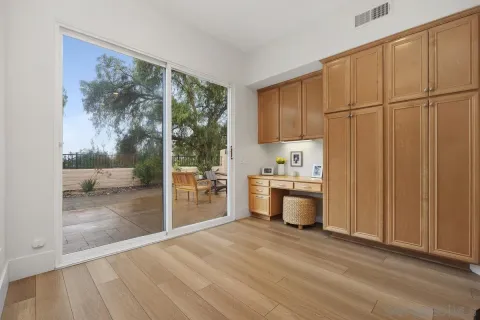 a view of a kitchen with a sink and a window
