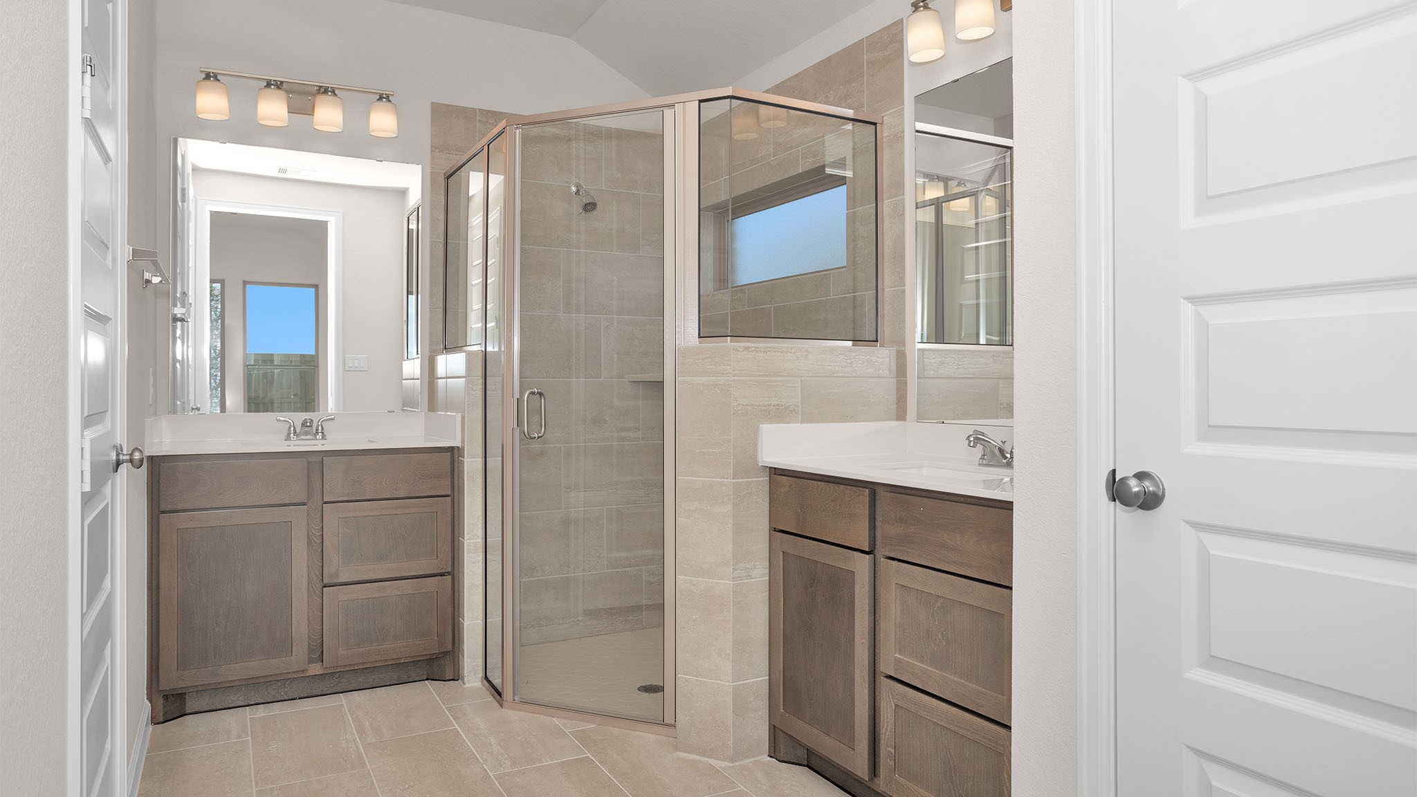 6058 Cottontail Lane Manvel, TX 77578 - Photo 13 of 26 a bathroom with a shower sink and mirror