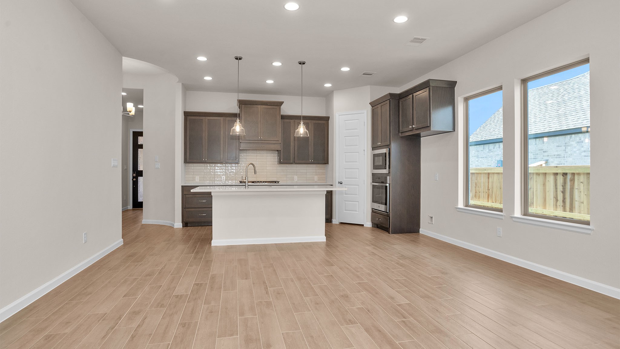 6058 Cottontail Lane Manvel, TX 77578 - Photo 8 of 26 a view of kitchen with stainless steel appliances refrigerator oven microwave and cabinets
