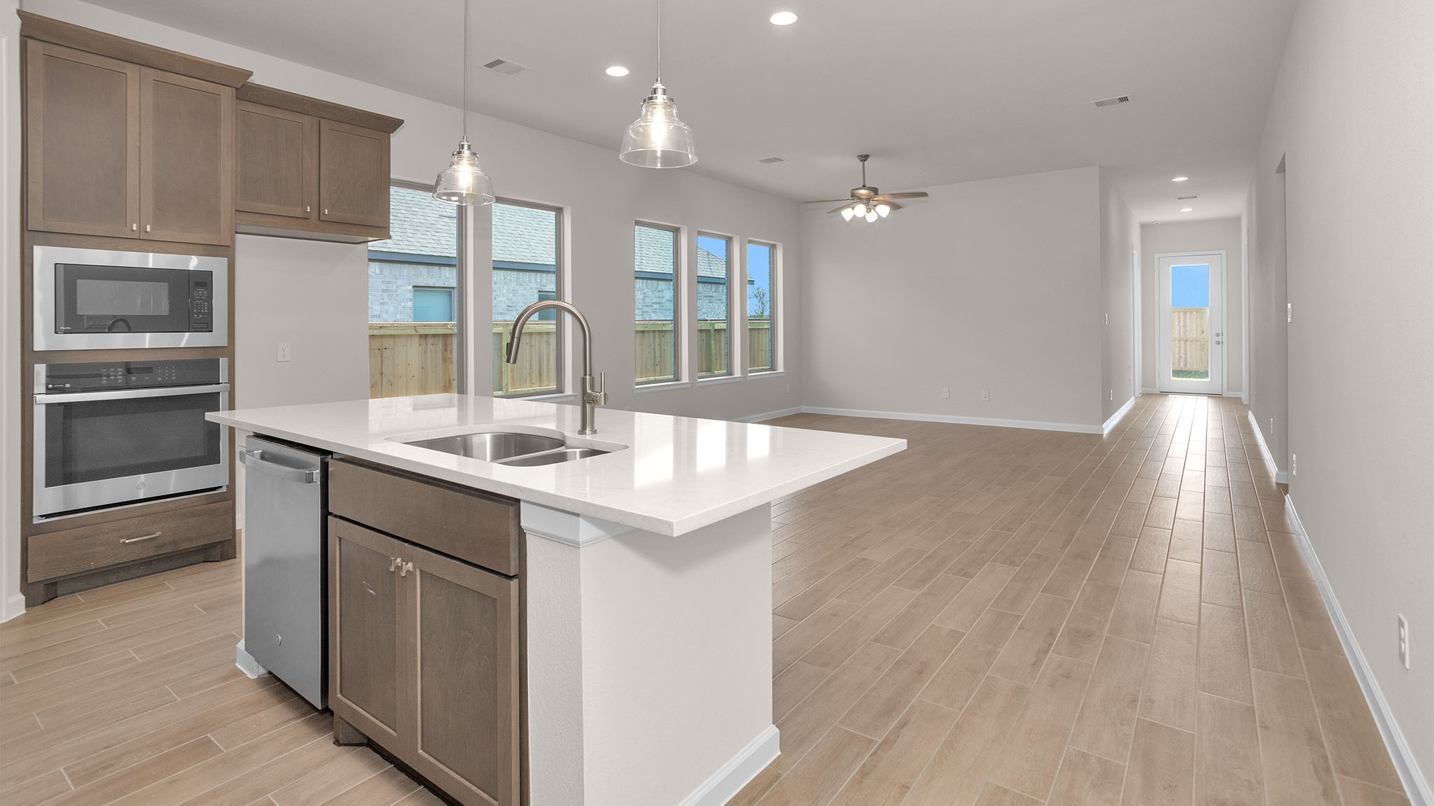 6058 Cottontail Lane Manvel, TX 77578 - Photo 9 of 26 a kitchen with granite countertop a sink and cabinets