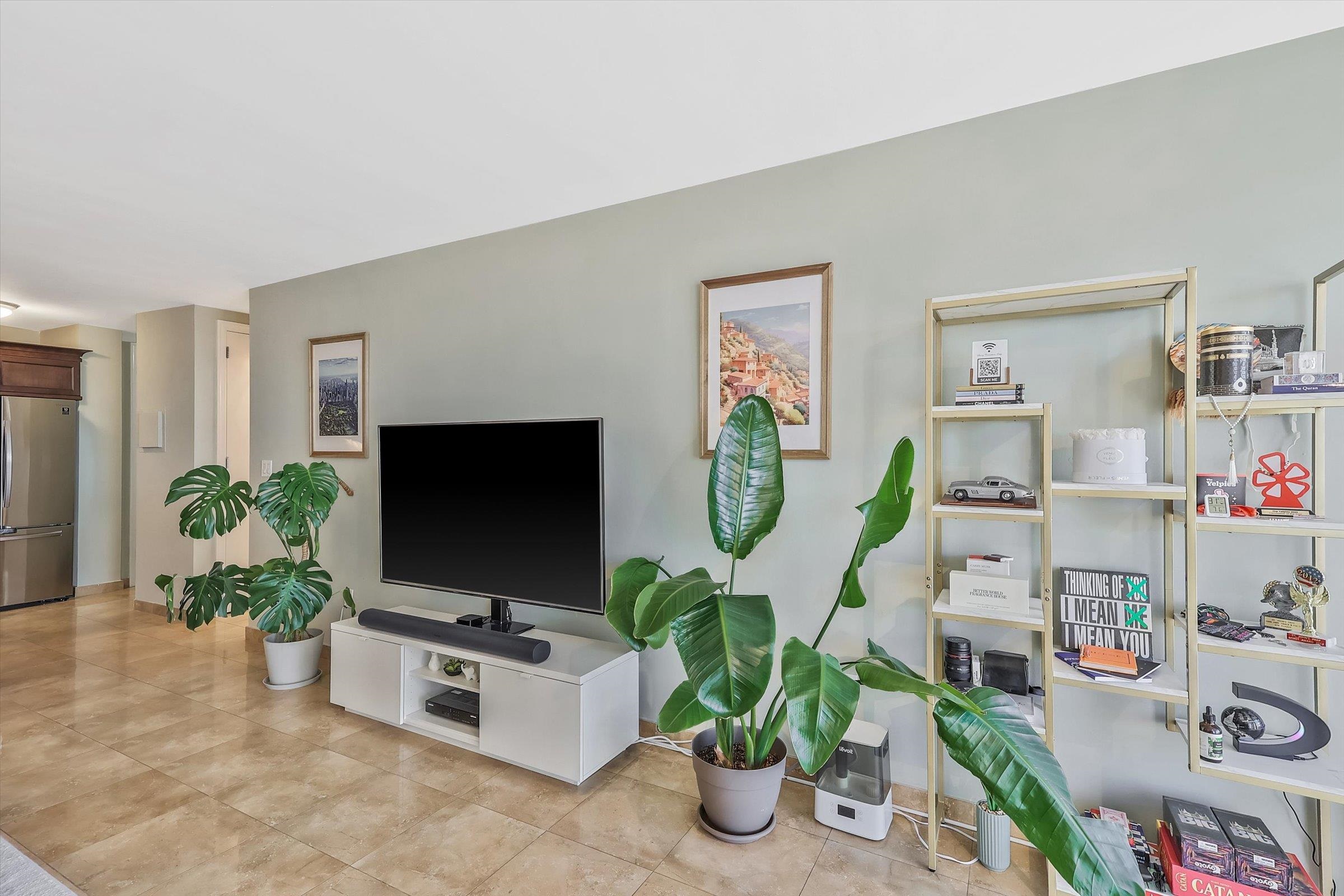380 Mountain Road, Unit 1015 Union City, NJ 07087 - Photo 14 of 43 a living room with furniture and a flat screen tv