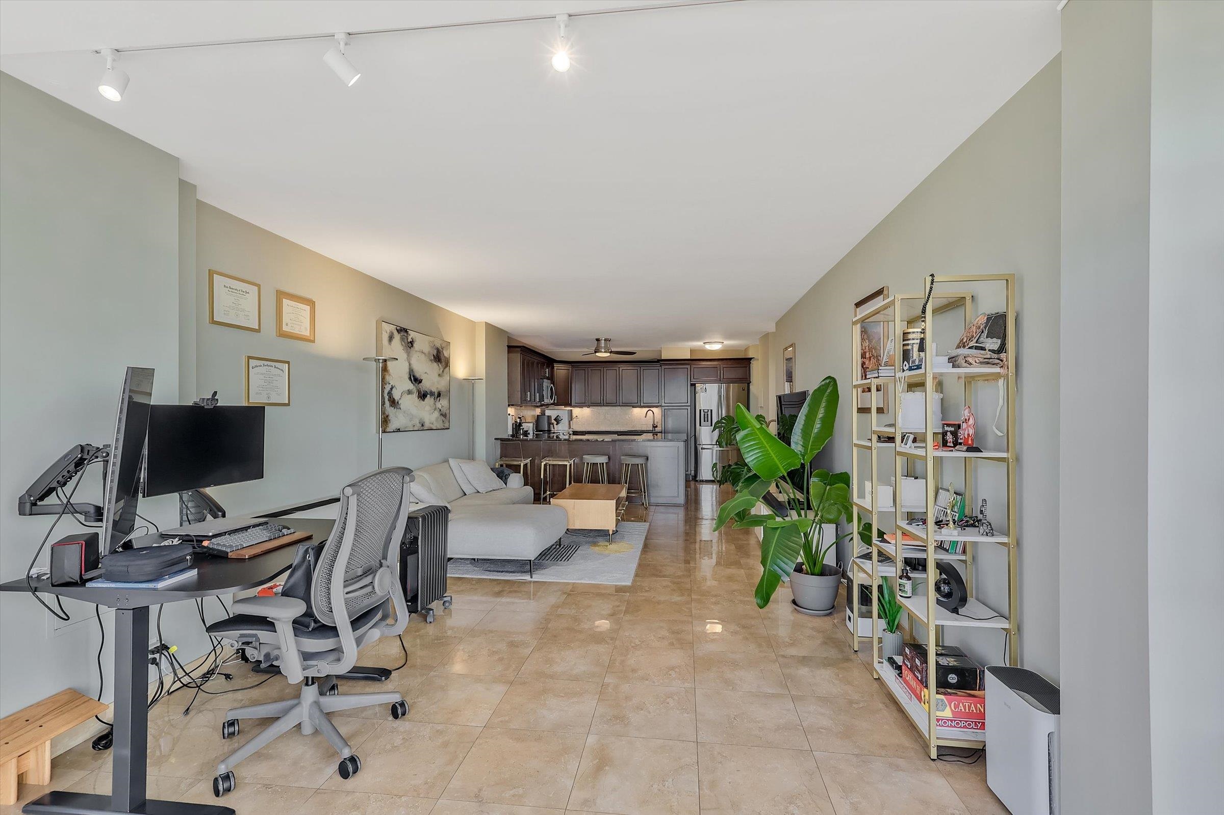 380 Mountain Road, Unit 1015 Union City, NJ 07087 - Photo 15 of 43 a view of a livingroom with workspace and a couch
