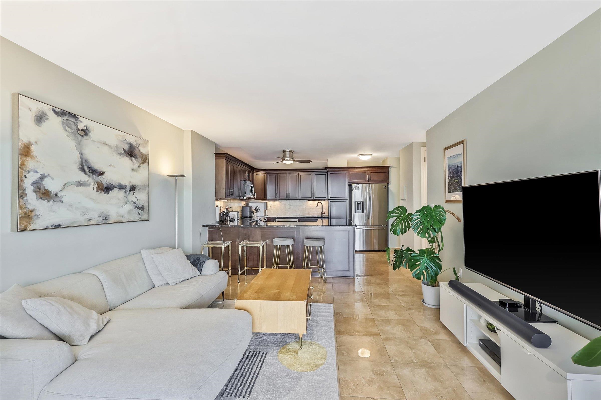 380 Mountain Road, Unit 1015 Union City, NJ 07087 - Photo 16 of 43 a living room with furniture and a flat screen tv
