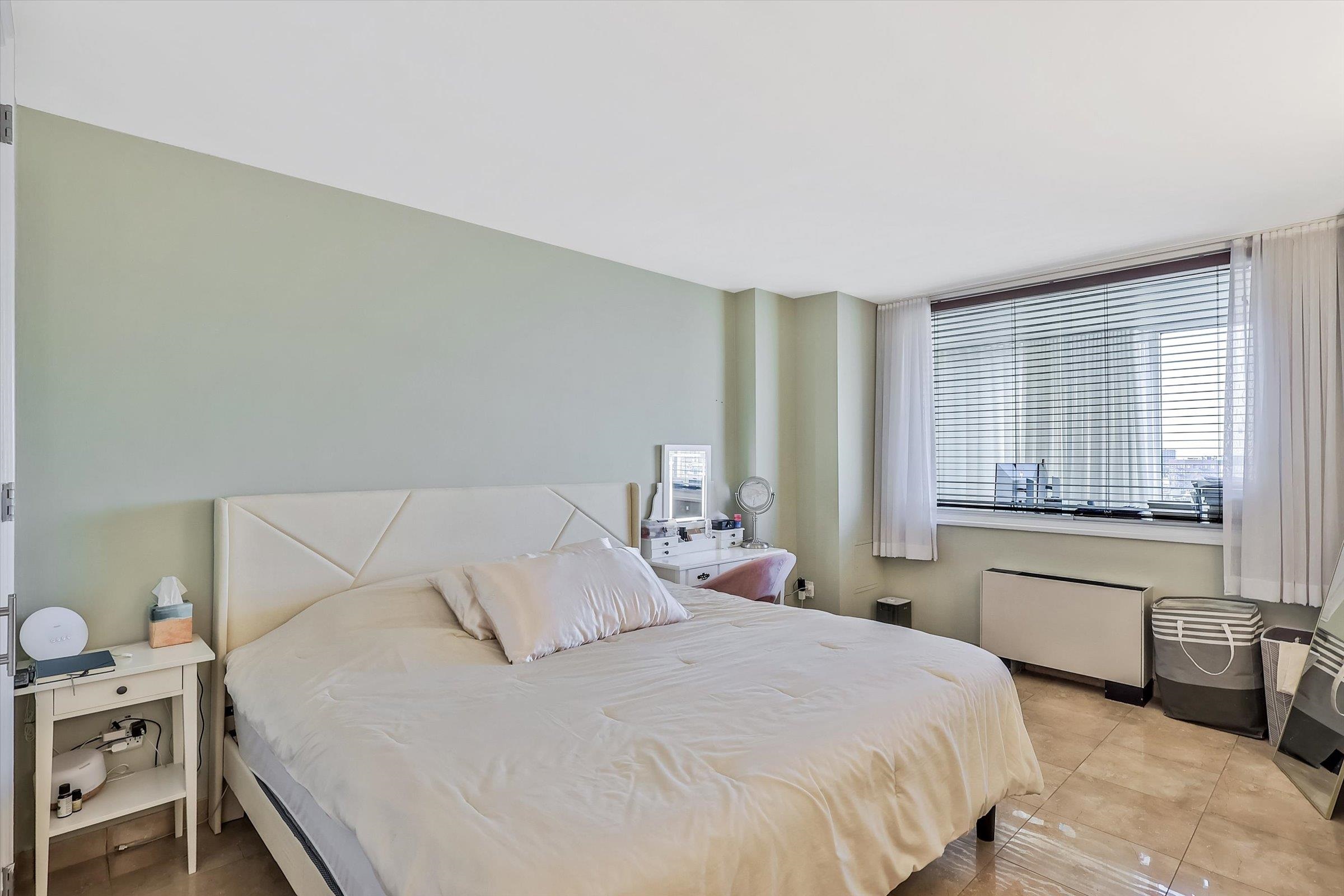 380 Mountain Road, Unit 1015 Union City, NJ 07087 - Photo 21 of 43 a bedroom with a bed and a cabinets