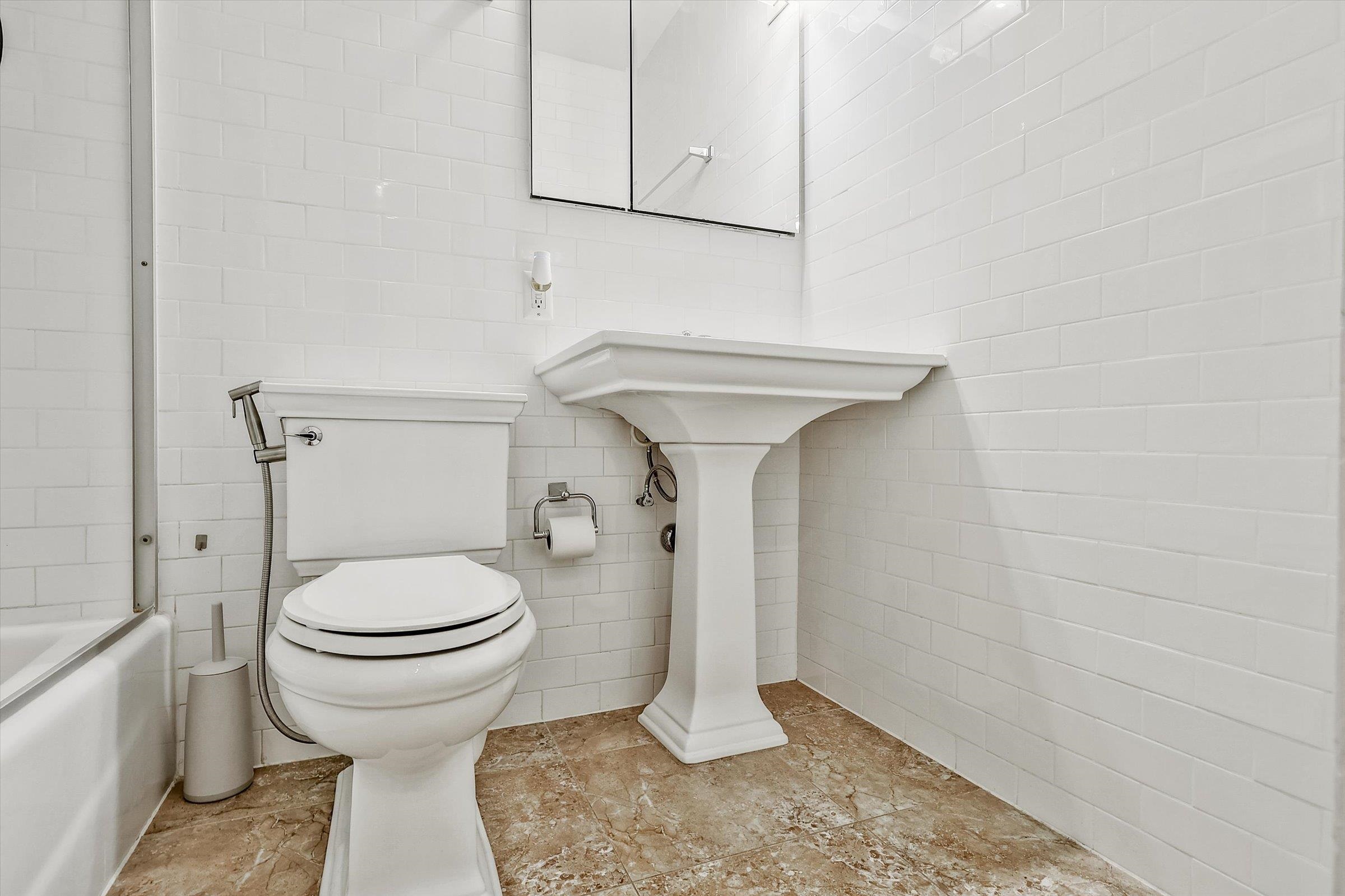 380 Mountain Road, Unit 1015 Union City, NJ 07087 - Photo 26 of 43 a bathroom with a sink and toilet