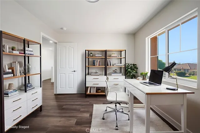 a workspace with furniture and window