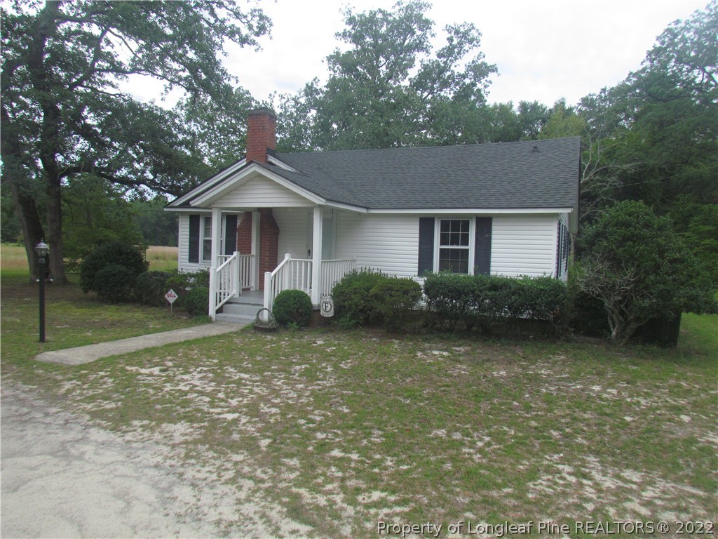 1635 Wade-Stedman Road Stedman, NC 28391 - Photo 1 of 23 a front view of a house with garden