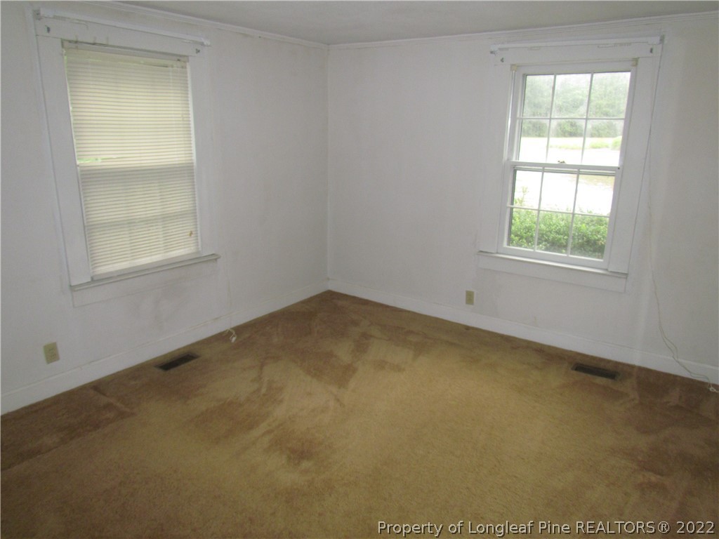 1635 Wade-Stedman Road Stedman, NC 28391 - Photo 18 of 23 an empty room with a window