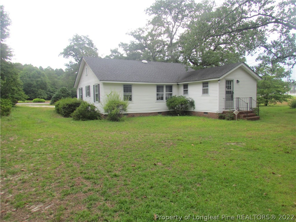 1635 Wade-Stedman Road Stedman, NC 28391 - Photo 22 of 23 a view of a house with yard and tree s