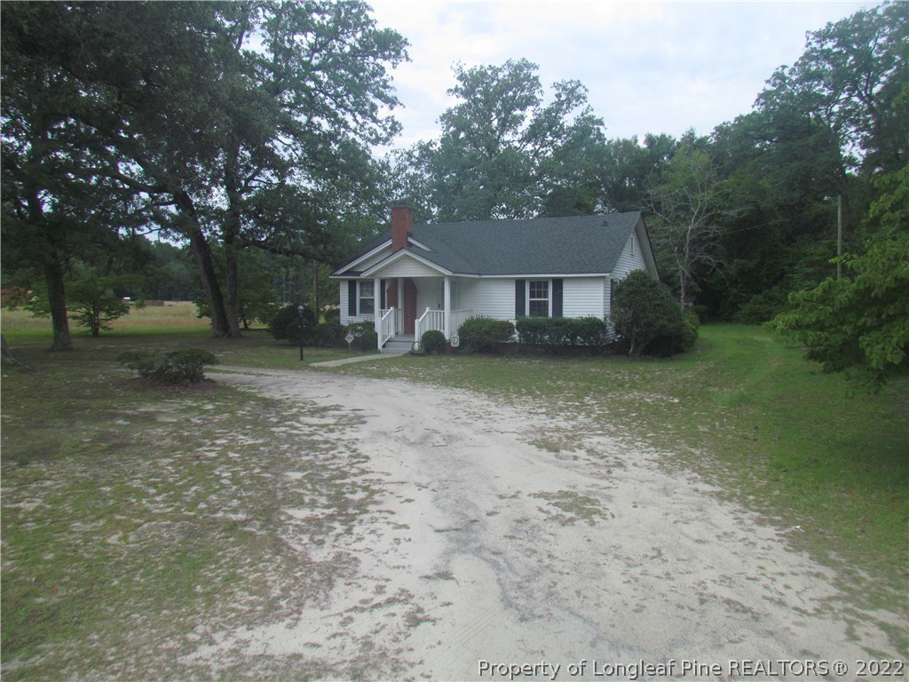 1635 Wade-Stedman Road Stedman, NC 28391 - Photo 3 of 23 front view of a house with a yard