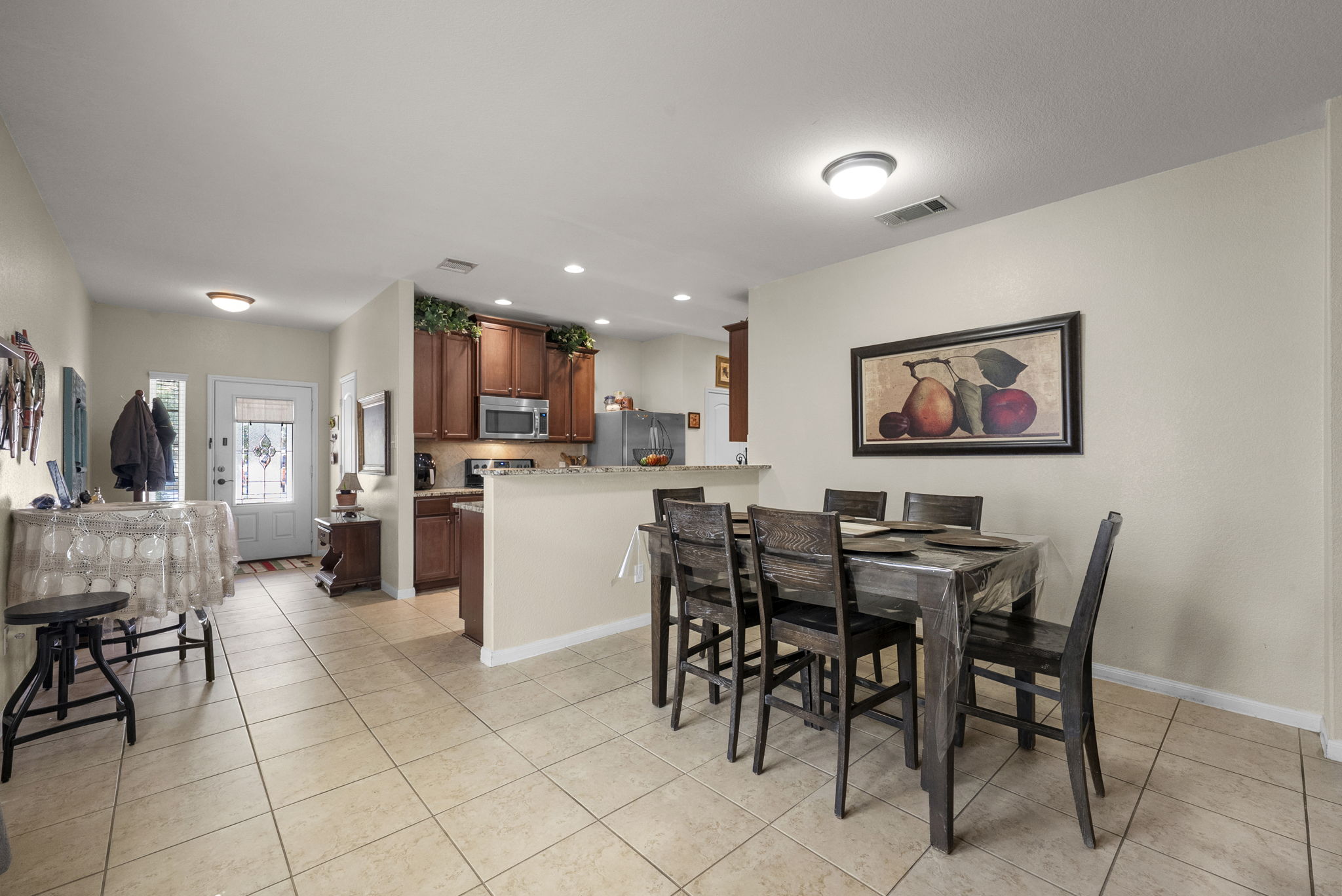 1617 Treeta Trail Kyle, TX 78640 - Photo 17 of 39 Dining space featuring recessed lighting and light tile patterned floors