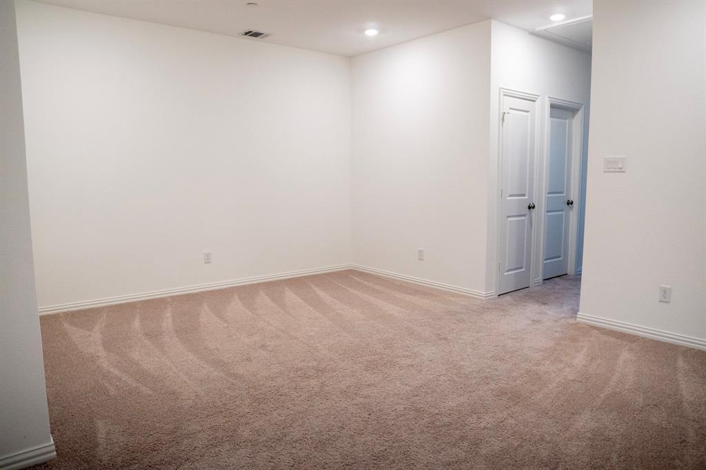 2913 Alto Drive Sachse, TX 75048 - Photo 5 of 5 an empty room with a workbench
