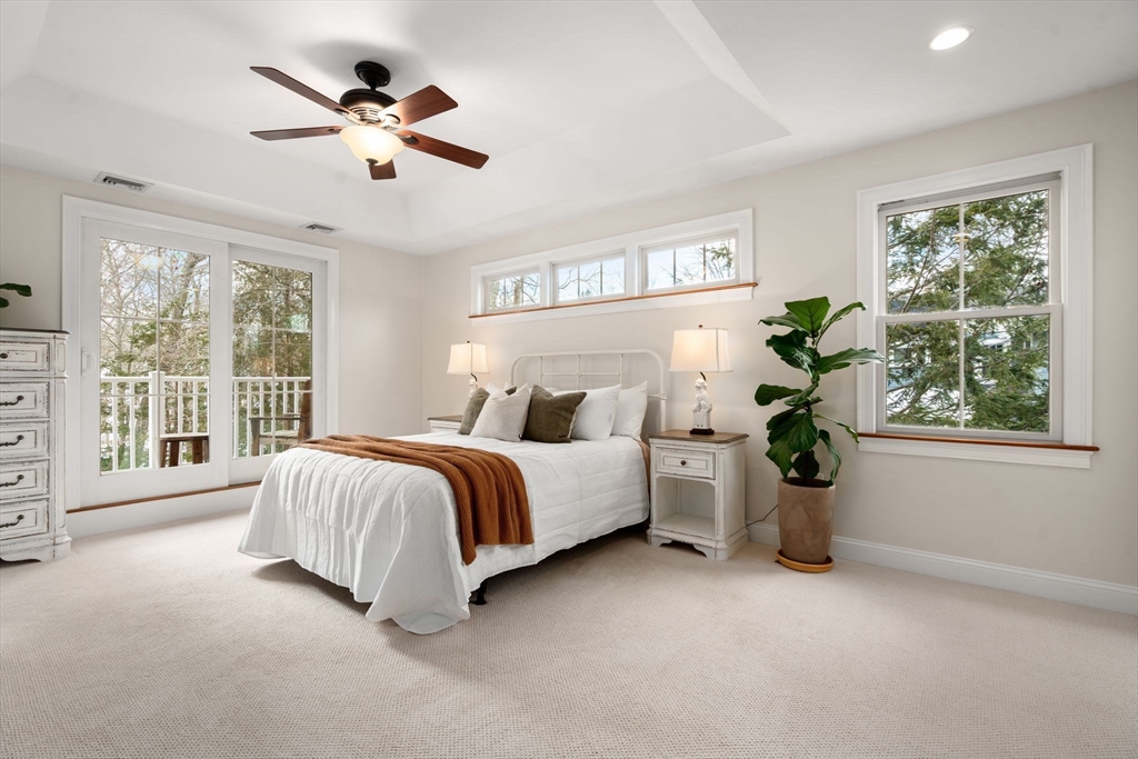 12 Vaille Avenue Lexington, MA 02421 - Photo 11 of 33 a spacious bedroom with a large bed and a large window