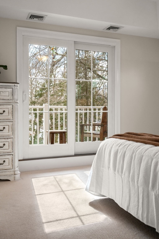 12 Vaille Avenue Lexington, MA 02421 - Photo 12 of 33 a bed sitting in a spacious bedroom next to a window