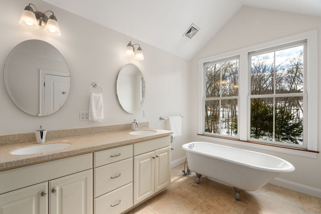 12 Vaille Avenue Lexington, MA 02421 - Photo 13 of 33 a spacious bathroom with a granite countertop double vanity sink and a mirror
