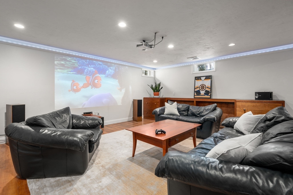 12 Vaille Avenue Lexington, MA 02421 - Photo 21 of 33 a living room with furniture and wall paintings