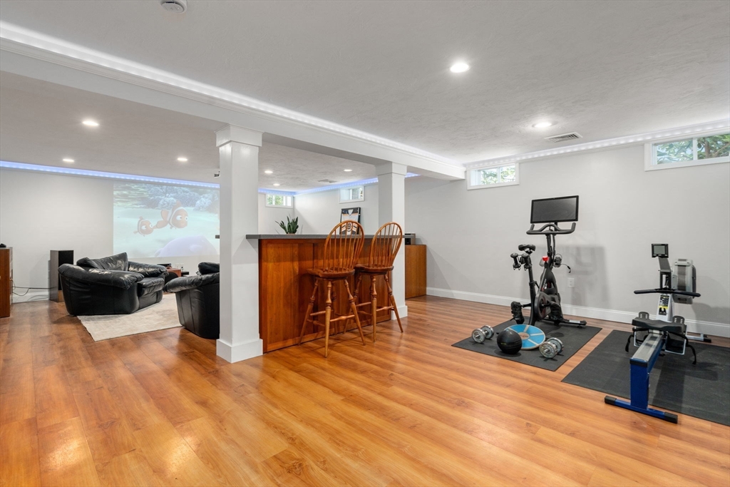 12 Vaille Avenue Lexington, MA 02421 - Photo 22 of 33 a room with furniture and wooden floor