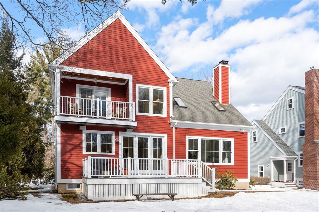 12 Vaille Avenue Lexington, MA 02421 - Photo 31 of 33 a front view of a house with a garden