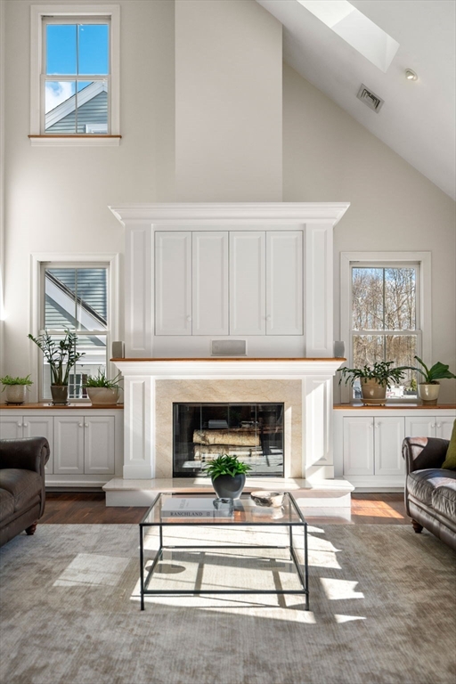 12 Vaille Avenue Lexington, MA 02421 - Photo 5 of 33 a living room with furniture and a fireplace