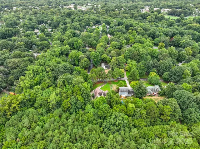 a view of a house is sitting in a forest
