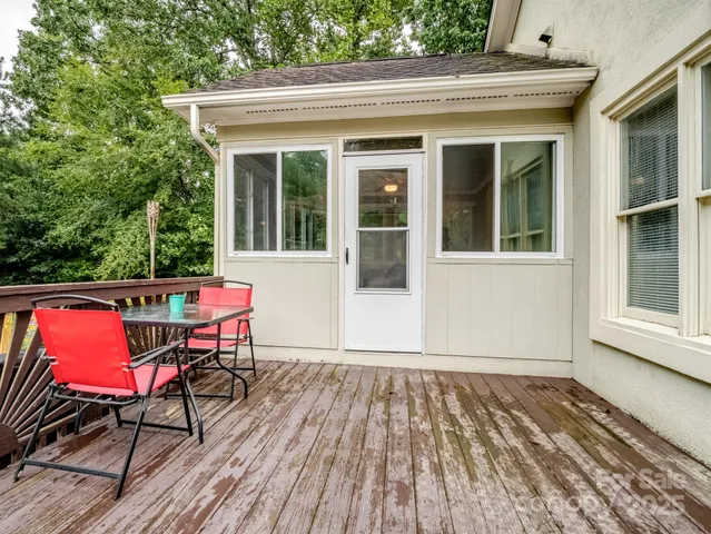 a view of a house with sitting area and wooden floor