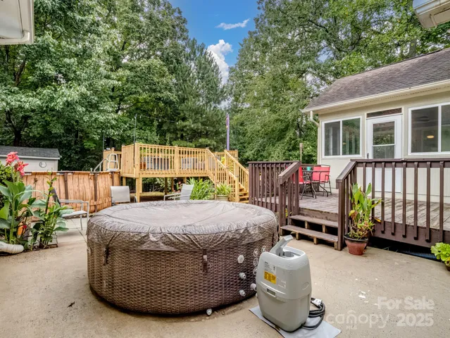 a view of a house with wooden fence