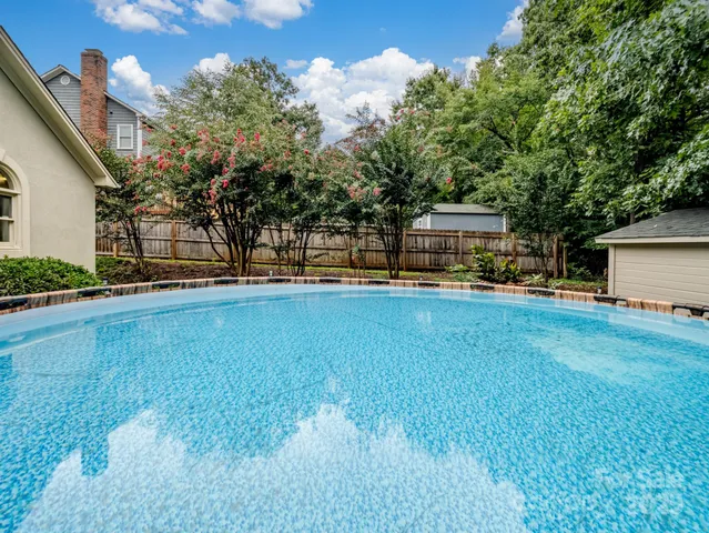 a view of a backyard with sitting area and furniture