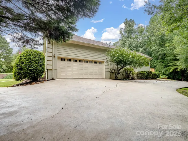 a view of a house with a yard and garage