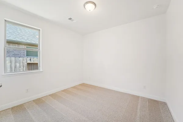 a view of a room that has a window in it