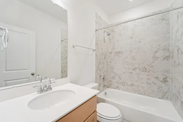 a bathroom with a sink a toilet and a bathtub