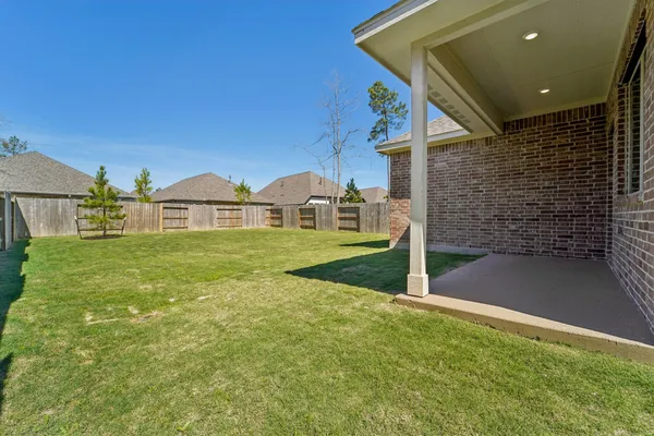 a view of an house with backyard and bathroom