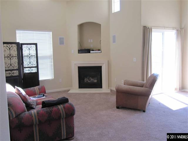 9050 Double R Boulevard Reno, NV 89511 - Photo 4 of 13 a living room with furniture and a fireplace