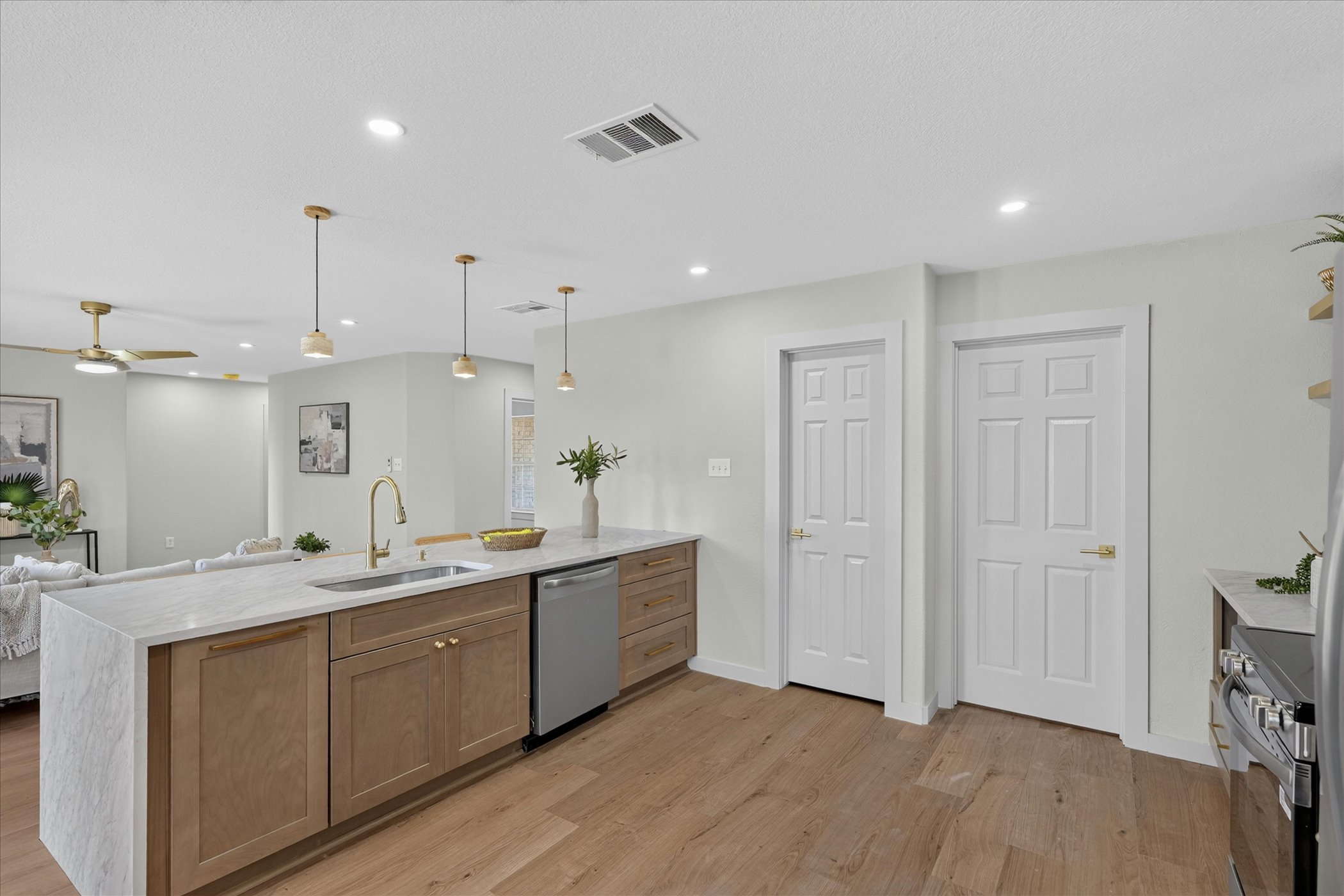 258 Pine View Loop Bastrop, TX 78602 - Photo 23 of 40 A well-appointed kitchen island with sleek countertops and modern fixtures, blending seamlessly into the open living space.