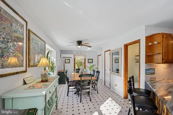 a view of a dining room with furniture window and outside view