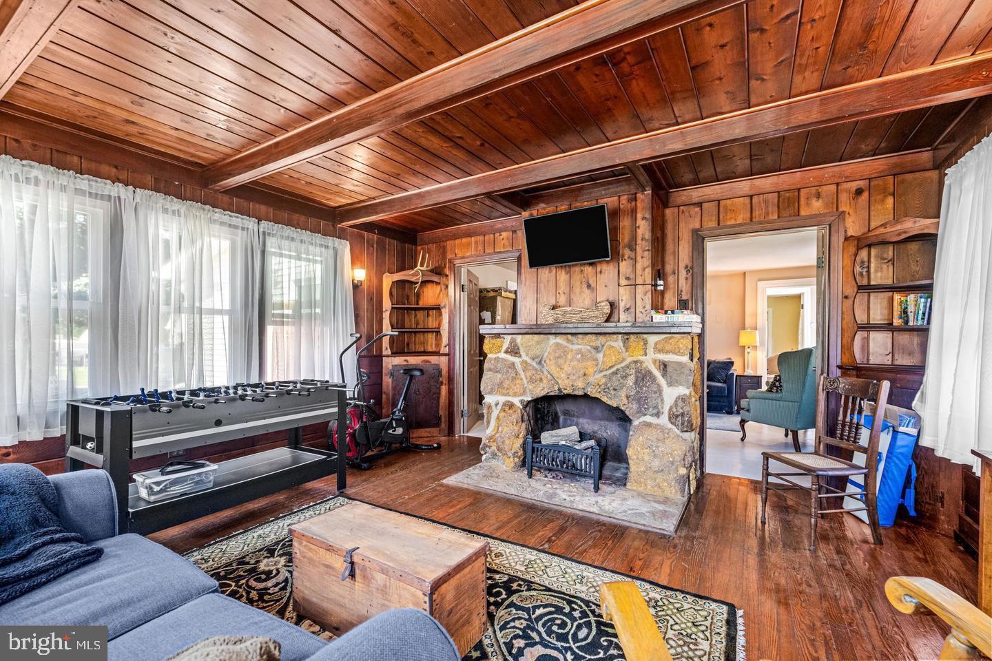 668 Crawford Road Cape May, NJ 08204 - Photo 16 of 66 a living room with furniture and a fireplace