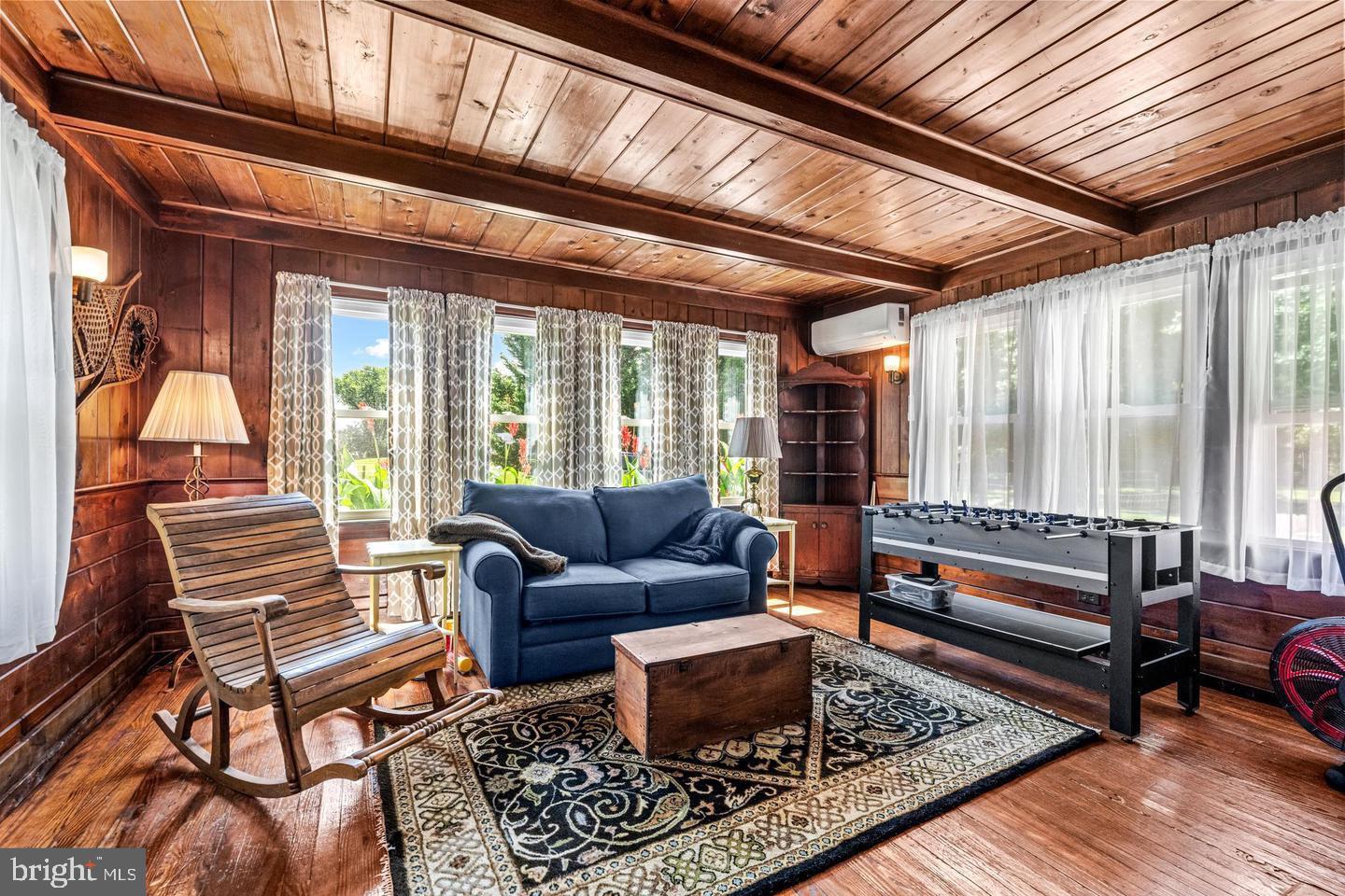 668 Crawford Road Cape May, NJ 08204 - Photo 17 of 66 a living room with furniture and a large window