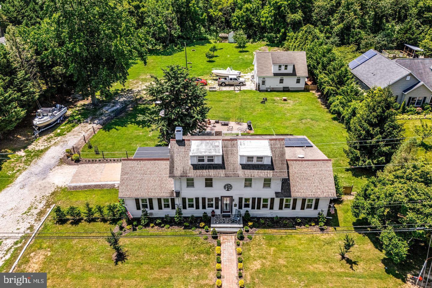 668 Crawford Road Cape May, NJ 08204 - Photo 2 of 66 a aerial view of a house with swimming pool and large trees