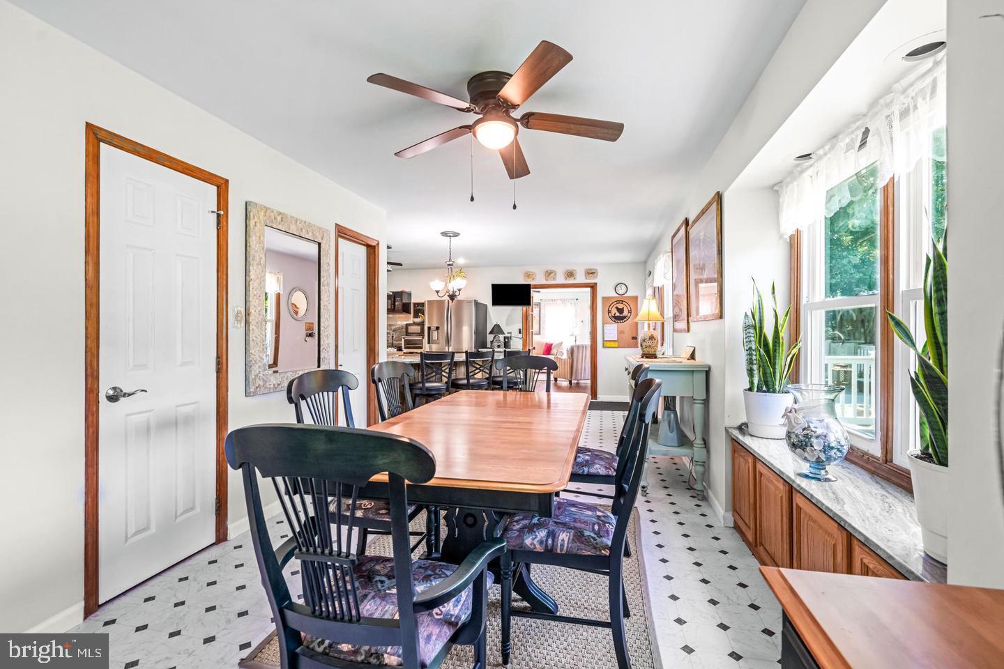 668 Crawford Road Cape May, NJ 08204 - Photo 27 of 66 a dining room with furniture window and wooden floor