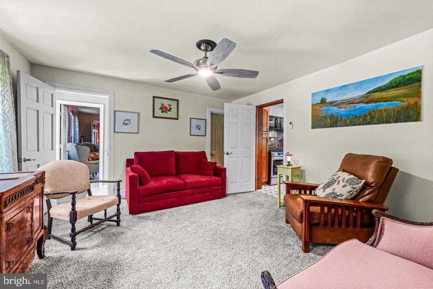 668 Crawford Road Cape May, NJ 08204 - Photo 29 of 66 a living room with furniture and a ceiling fan