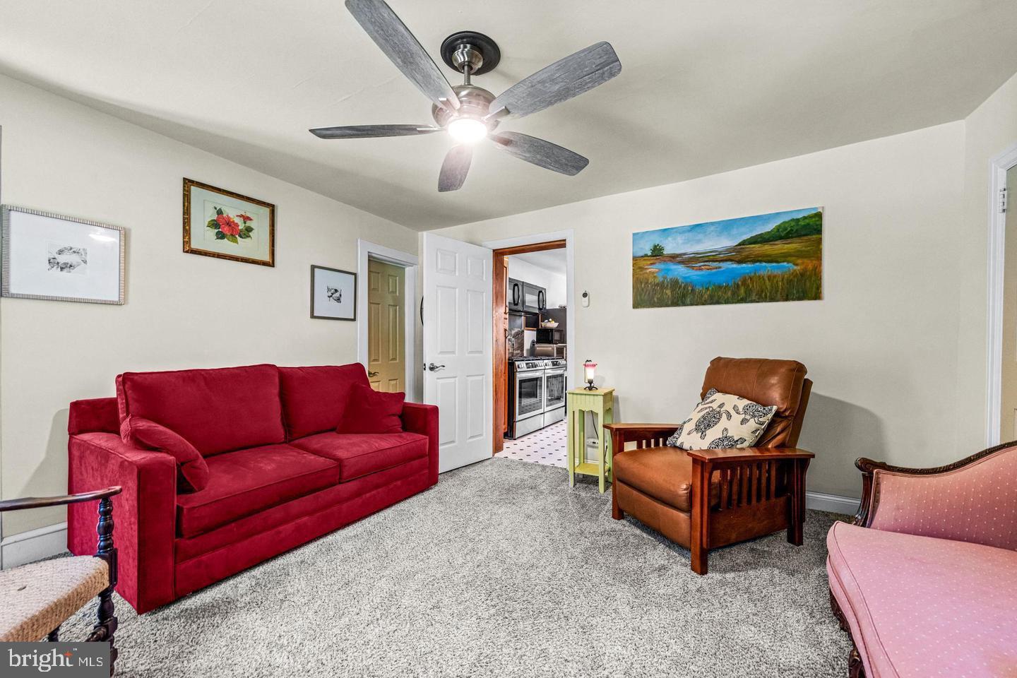 668 Crawford Road Cape May, NJ 08204 - Photo 30 of 66 a living room with furniture and a flat screen tv