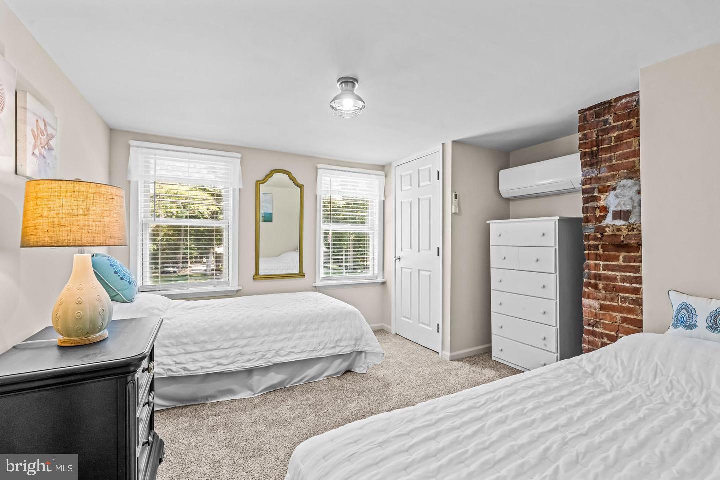 668 Crawford Road Cape May, NJ 08204 - Photo 43 of 66 a bedroom with a bed and wooden floor