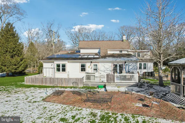 an aerial view of a house with a yard basket ball court and outdoor seating