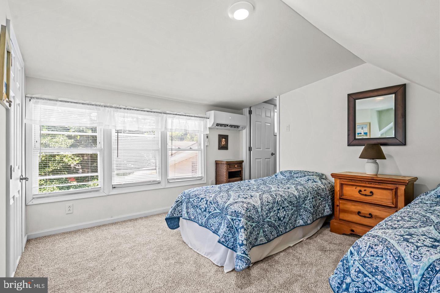 668 Crawford Road Cape May, NJ 08204 - Photo 46 of 66 a bedroom with a bed dresser and window